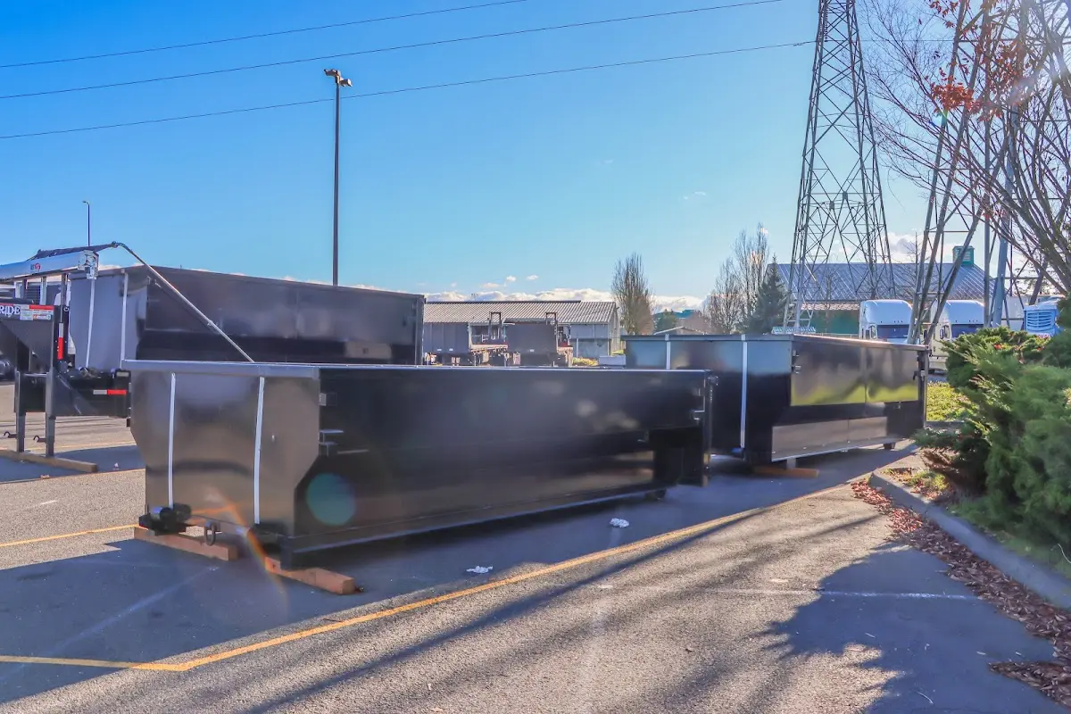 Roll-off dumpster ready for waste disposal at job site for 2 Yard Dumpster Rental in Rogers